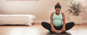 Picture of pregnant person doing yoga for release about maternal health.