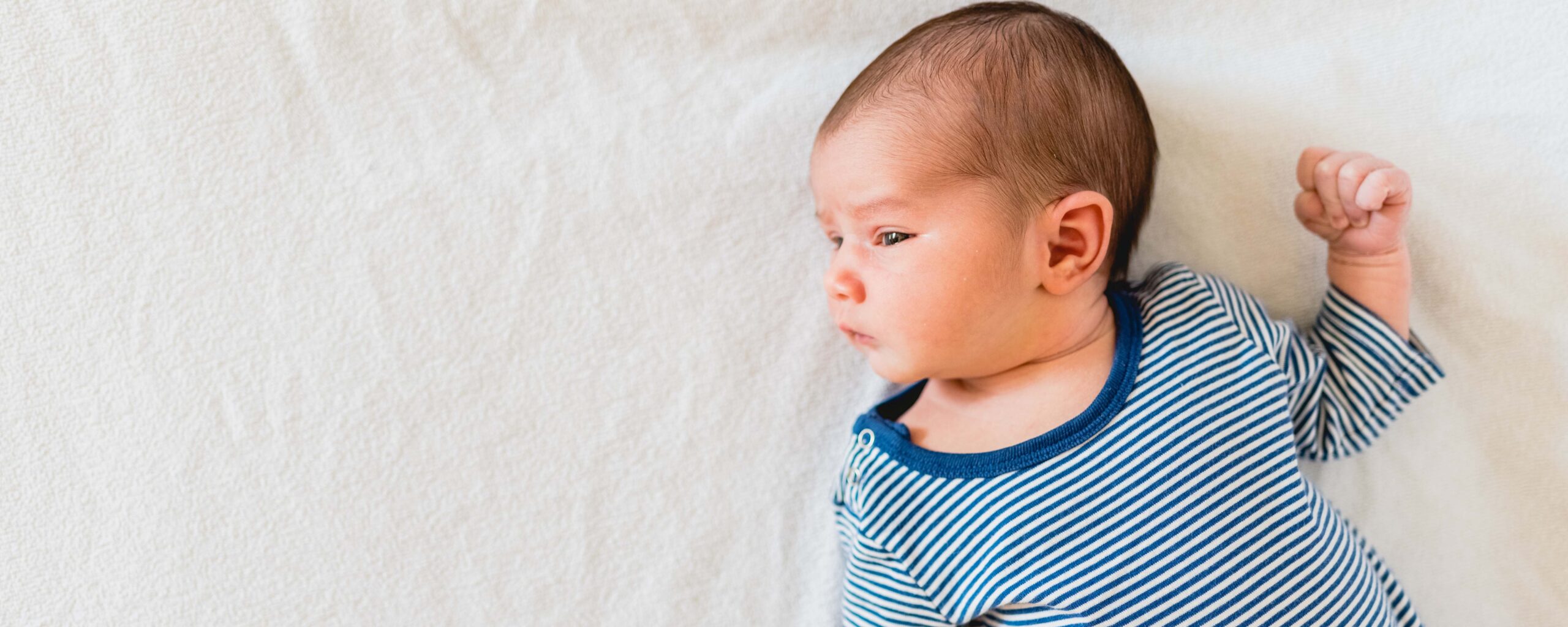 Photo of infant on back for story on SIDS
