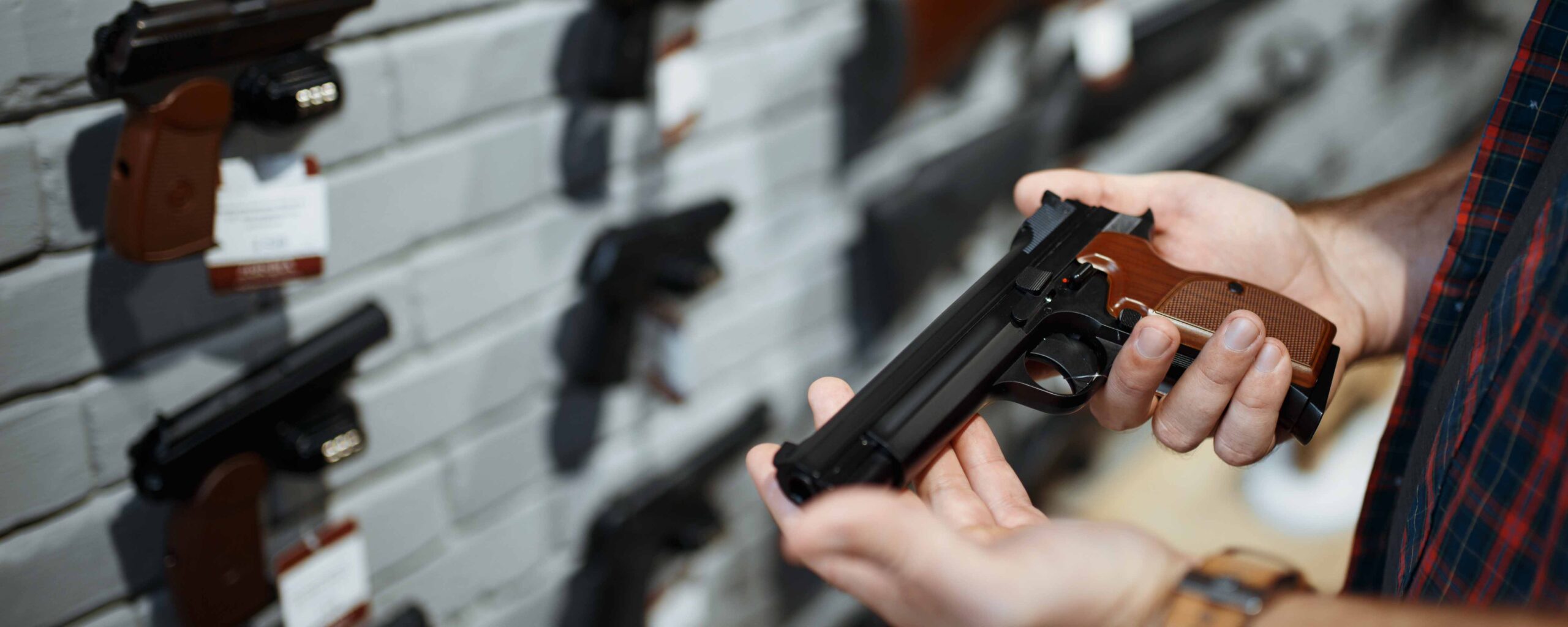 Image of a man holding a handgun
