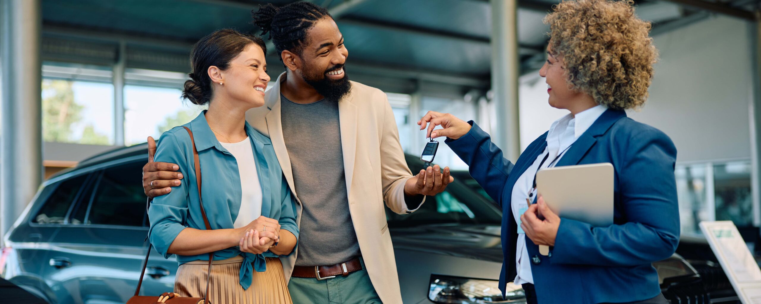 Photo of a couple buying a car