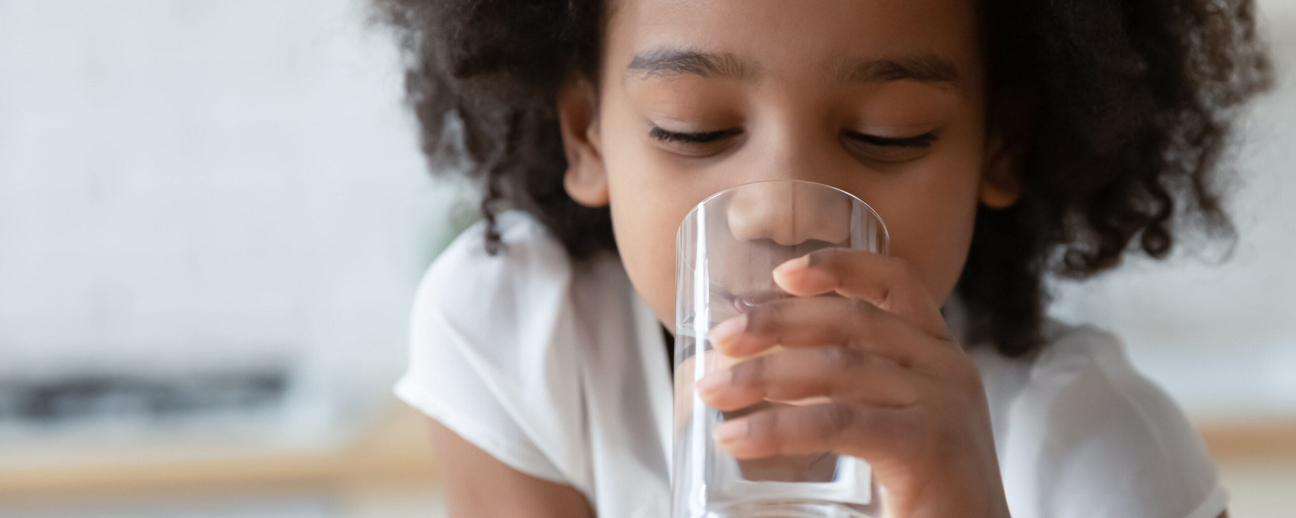 Girl drinking water. For story about US views on fluoride in drinking water supplies.