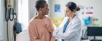 Primary care physician examining patient. Healthcare image.